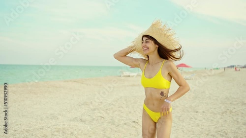 Wallpaper Mural Sexy body woman with perfect slim fit body in yellow bikini runs on sand beach to sea. Happy beautiful fitness body girl on travel vacation in Ukraine Torontodigital.ca