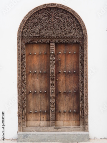 Traditional Zanzibar door with spikes. Indian door style.