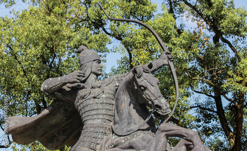 Bronze statue of a Chinese archer mounted on a horse aiming