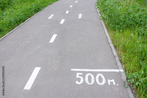 Wallpaper Mural Bike path in a forest park with a marking of the center of the path, arrows for the direction of movement and distance from the beginning of the path. Torontodigital.ca