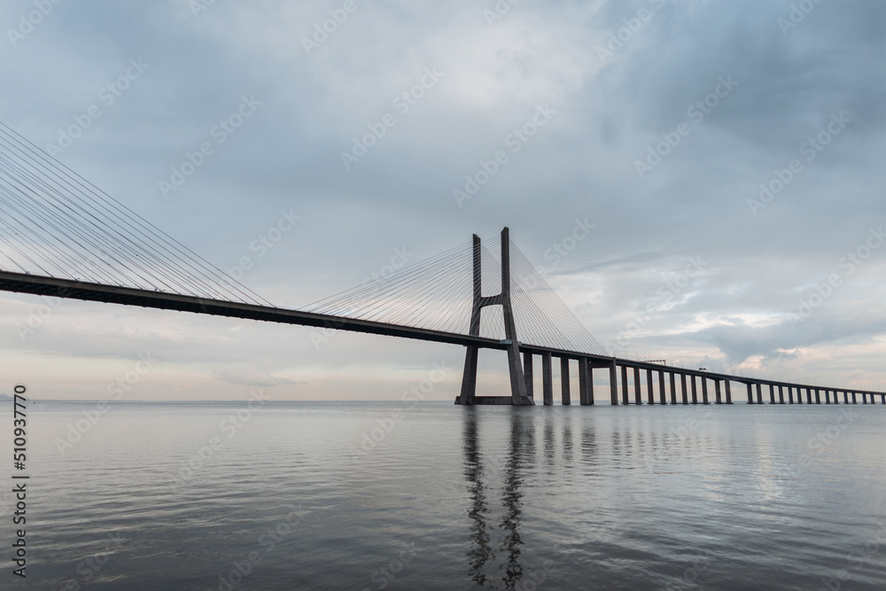 Amazing beautiful long Vasco da Gama Bridge on a cloudy day in Lisbon, Portugal