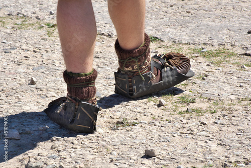 Unusual shoes on the feet of a man.