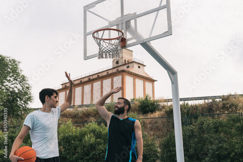 Принти на полотні Happy young boys shaking hands after a street basketball game