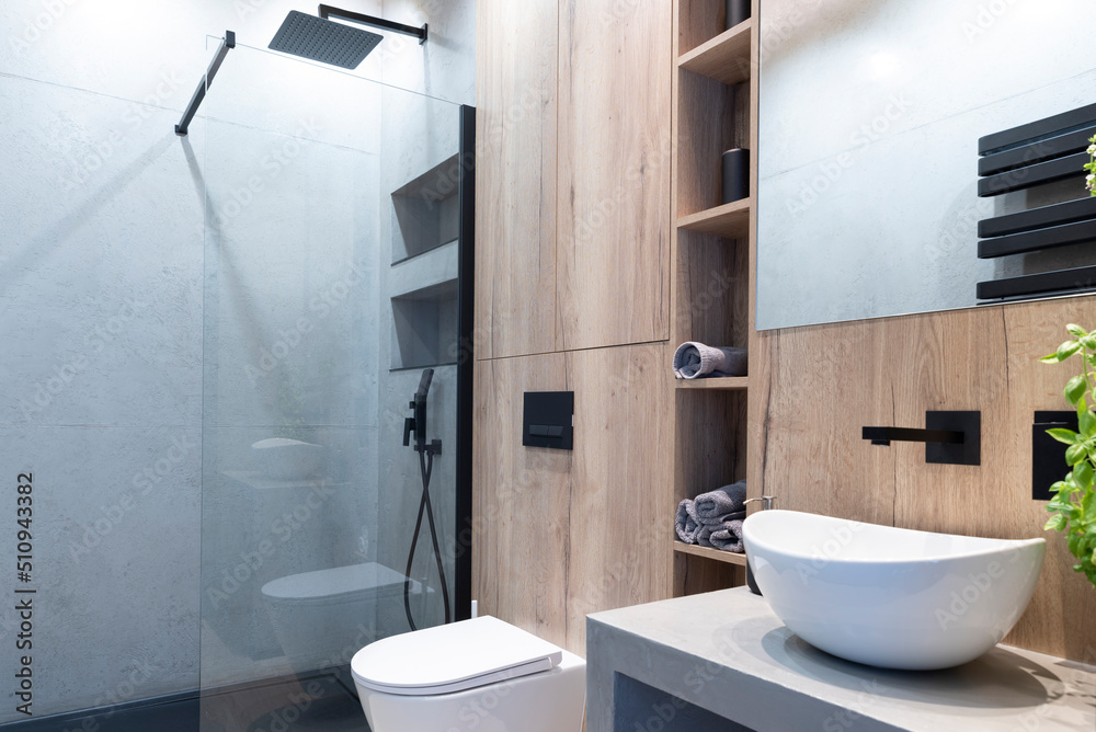 Modern bathroom with stylish bowl on the counter with faucet and modern ...