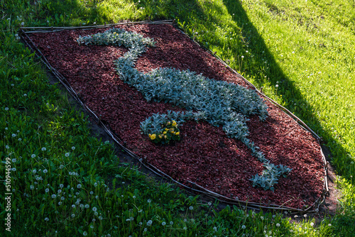 Grobina town coat of arms crane, made of growing flowers, Latvia. photo