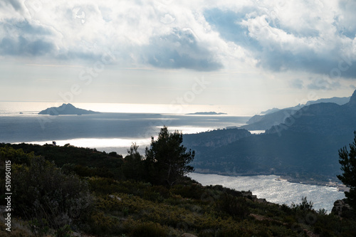 Touristic route D141 road from La Ciotat to Cassis, panoramic aerial view on harbour of Cassis, blue sea, limestone's cliffs and green pine forest, vacation in Provence, France