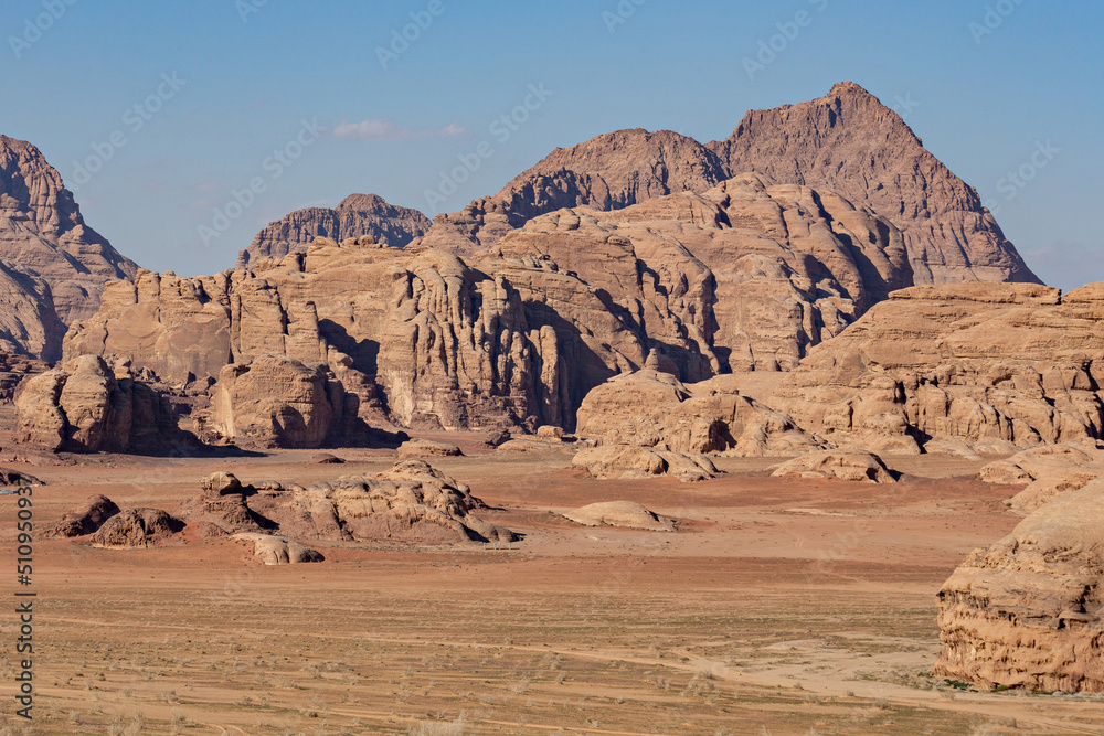 Stone formations in Wadi Rum desert. Sunny day in Wadi Rum, Jordan Stone formations in Wadi Rum desert. Sunny day in Wadi Rum, Jordan