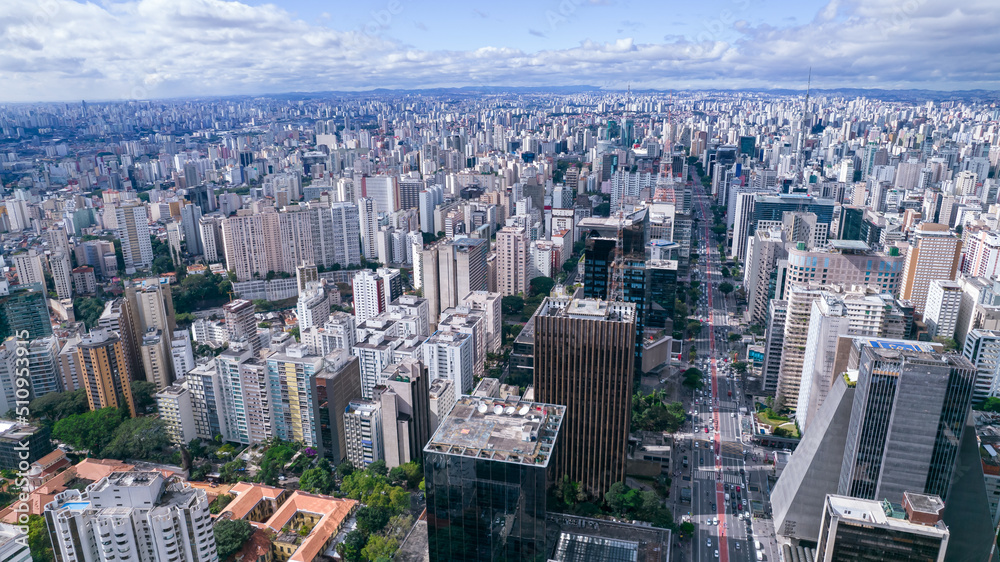 Fototapeta premium Aerial view of Av. Paulista in São Paulo, SP. Main avenue of the capital. With many radio antennas, commercial and residential buildings. Aerial view of the great city of São Paulo.
