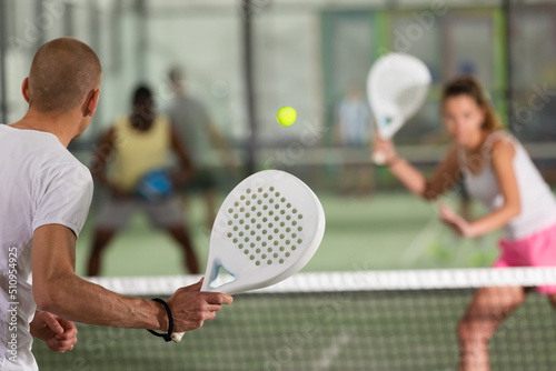 Obraz na plátně Man playing padel tennis on the padel court