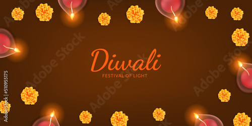 Happy diwali. oil lamp candle with marigold flower on the dark background for greeting card template