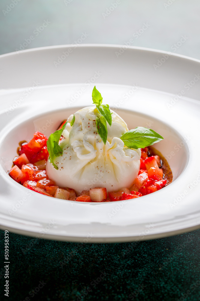 salad with buratta cheese and strawberries with basil macro close up vertical salad with buratta cheese and strawberries with basil macro close up vertical