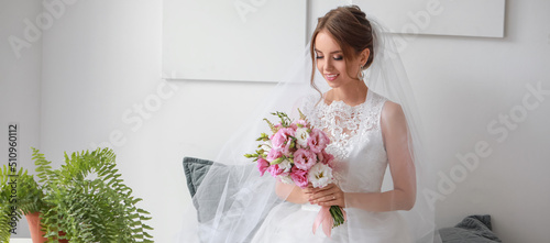 Pretty young bride with bou...