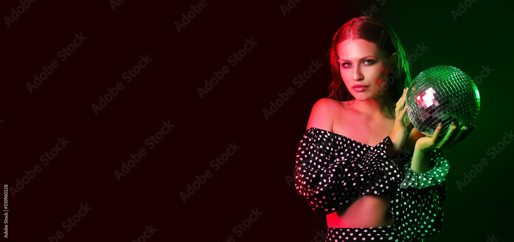 Fashionable young woman holding disco ball on dark background with space for text Fashionable young woman holding disco ball on dark background with space for text