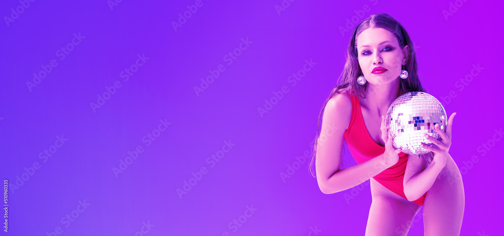 Fashionable young woman holding disco ball on color background with space for text Fashionable young woman holding disco ball on color background with space for text