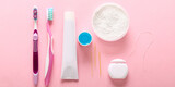 Set for dental hygiene on pink background, top view