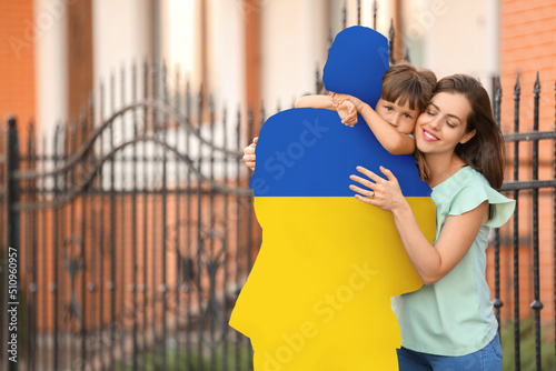 Happy family hugging silhou...