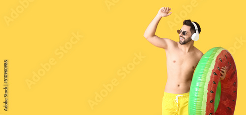 Happy young man with inflat...