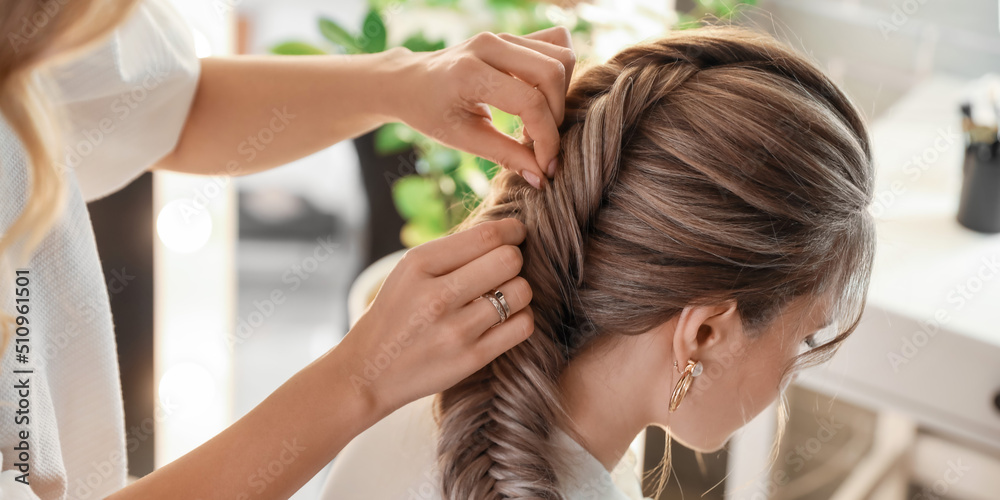Hairdresser working with client in beauty salon Hairdresser working with client in beauty salon