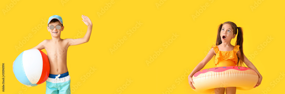 Little children with beach ball and inflatable ring on yellow background. Banner for design