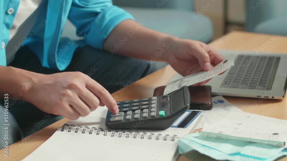 Close Up Of Man'S Hand Holding Bill And Calculating Money By Calculator
Close Up Of Man'S Hand Holding Bill And Calculating Money By Calculator