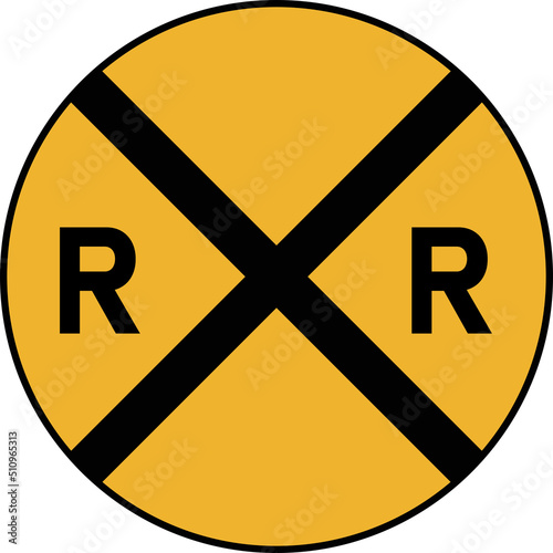 A road sign ahead of a railway crossing.