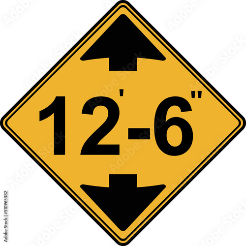 A road sign, a low bridge or overpass ahead.