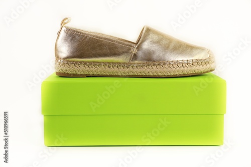 espadrille shoe on green box