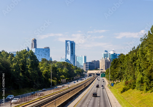 North Atlanta neighborhood of Buckhead displaying several buildings, city streets, hotels and high rises under a blue sky. photo