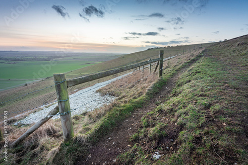 Fototapeta Naklejka Na Ścianę i Meble -  Closeup of section of the Alton Barnes White Horse,and surrounding barbed wire fence,Wiltshire,England,UK.