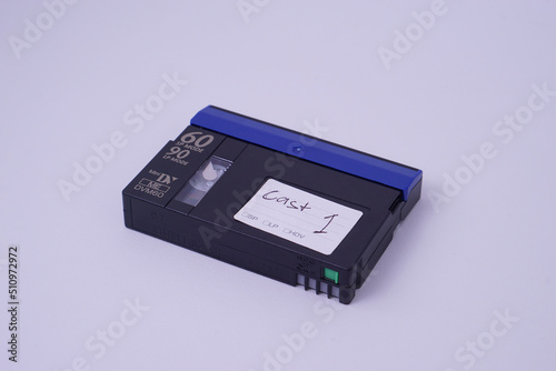 high angle view, Front isometric view of Mini DV video cassette tape isolate on white studio lighting background. photo