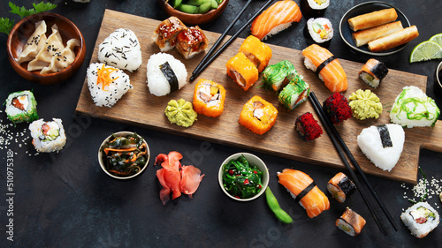 Japanese food assortment on dark background.