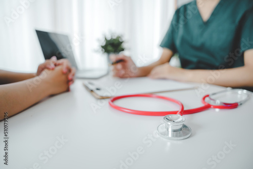 portrait of a female doctor She is recommending medications and treatment methods at the clinic.