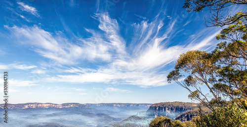 Windy Sky Over a Foggy Canyon of Blue Mountains, Australia photo