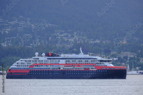 Hurtigruten expedition vessel cruiseship cruise ship liner Roald Amundsen arrival into Port of Vancouver, Canada during early morning sunrise twilight blue hour after Alaska cruising photo