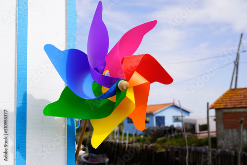 Colorful pinwheel in summer beach street for children wheels play wind in plastic