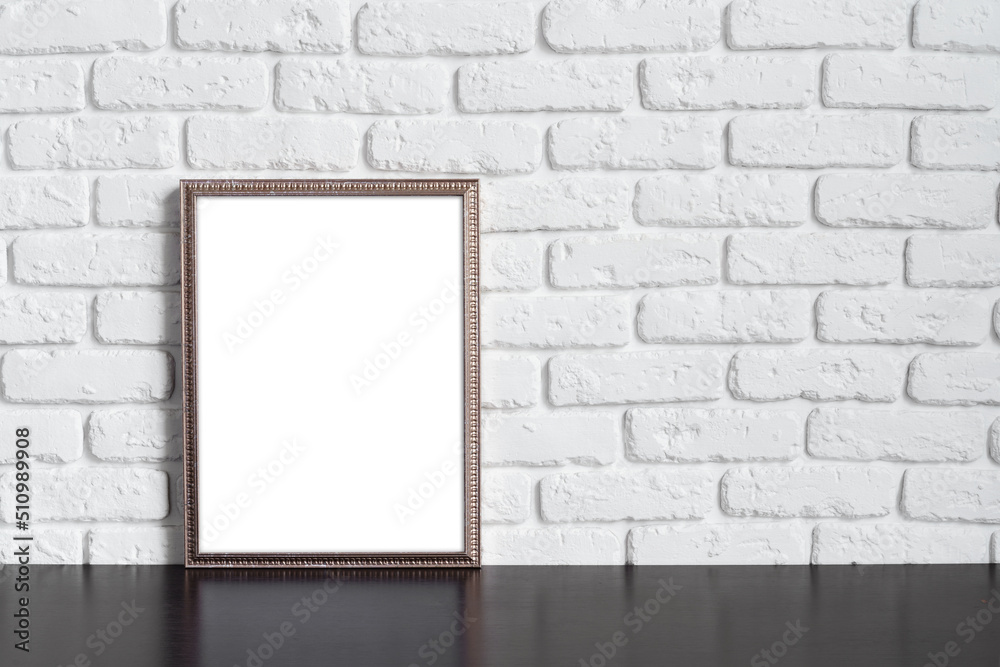 Blank picture frame against brick wall with copy space Blank picture frame against brick wall with copy space