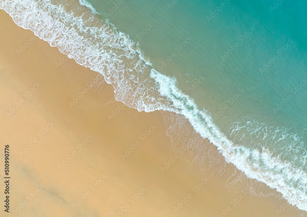 Top view of Beach sand copy space Beautiful sea waves in Summer tropical background Top view of Beach sand copy space Beautiful sea waves in Summer tropical background
