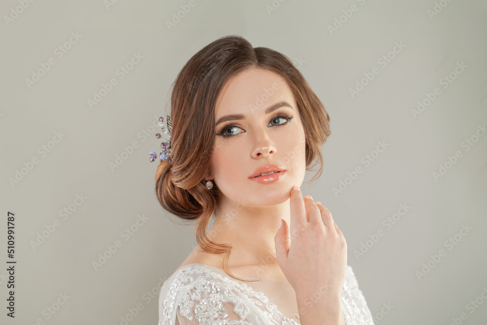 Portrait of a cheerful beautiful young woman with natural fresh makeup and hairstyle