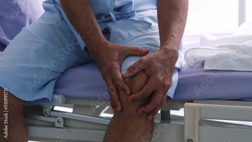 An elderly Asian male patient is hospitalized with knee pain.