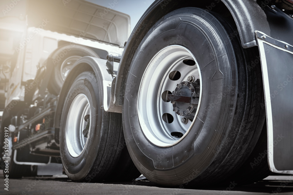 Rear of Semi Truck Wheels Tires. Rubber, Vechicle Tyres. Freight Trucks Cargo Transport. Auto Repair Service Shop. 		