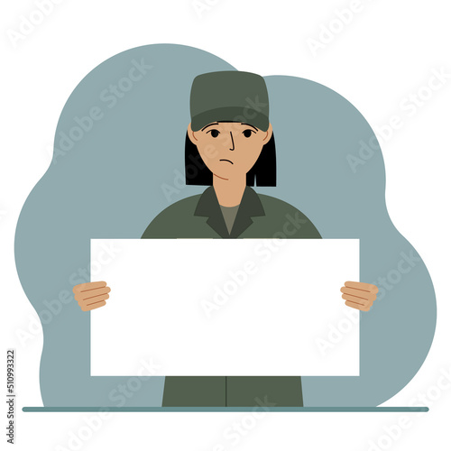 A military man in uniform holds a white sheet of paper in his hands. Concept for advertising, poster, banner.