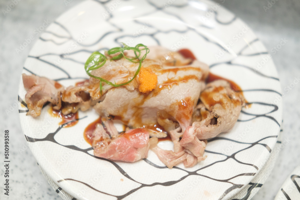 A dish of sliced and roasted Japanese beef sushi A dish of sliced and roasted Japanese beef sushi