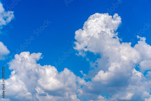 Beautiful white clouds on a bright blue background.