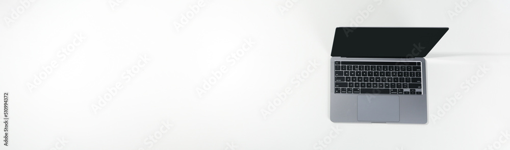 Open laptop on white background, space for text