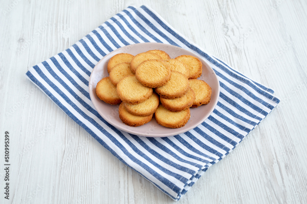 Homemade Pure Butter Shortbreads on a Pink Plate, side view. Homemade Pure Butter Shortbreads on a Pink Plate, side view.