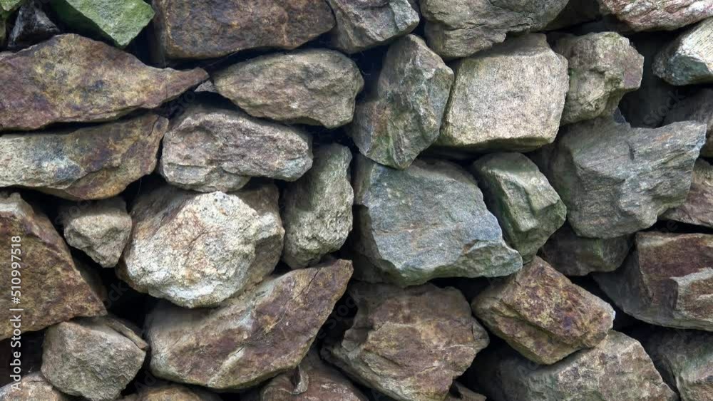 A wall of carefully stacked large stones A wall of carefully stacked large stones