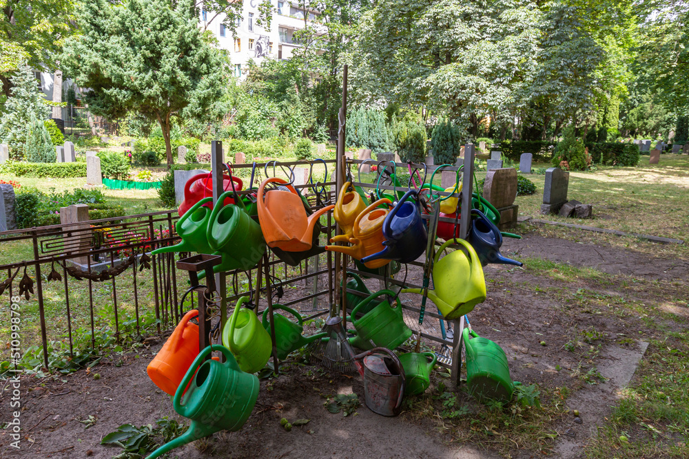 Watering Cans stacked in a Berlin City Park Watering Cans stacked in a Berlin City Park