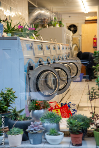 Photography Looking through a window of a Colourful Launderette