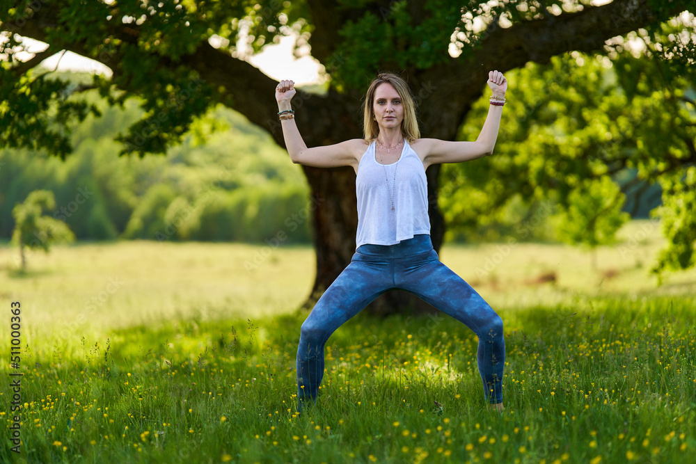 Young woman yoga practitioner in the forest Young woman yoga practitioner in the forest