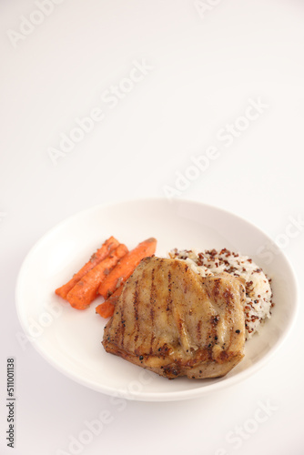 Grilled chicken with rice isolated in white background